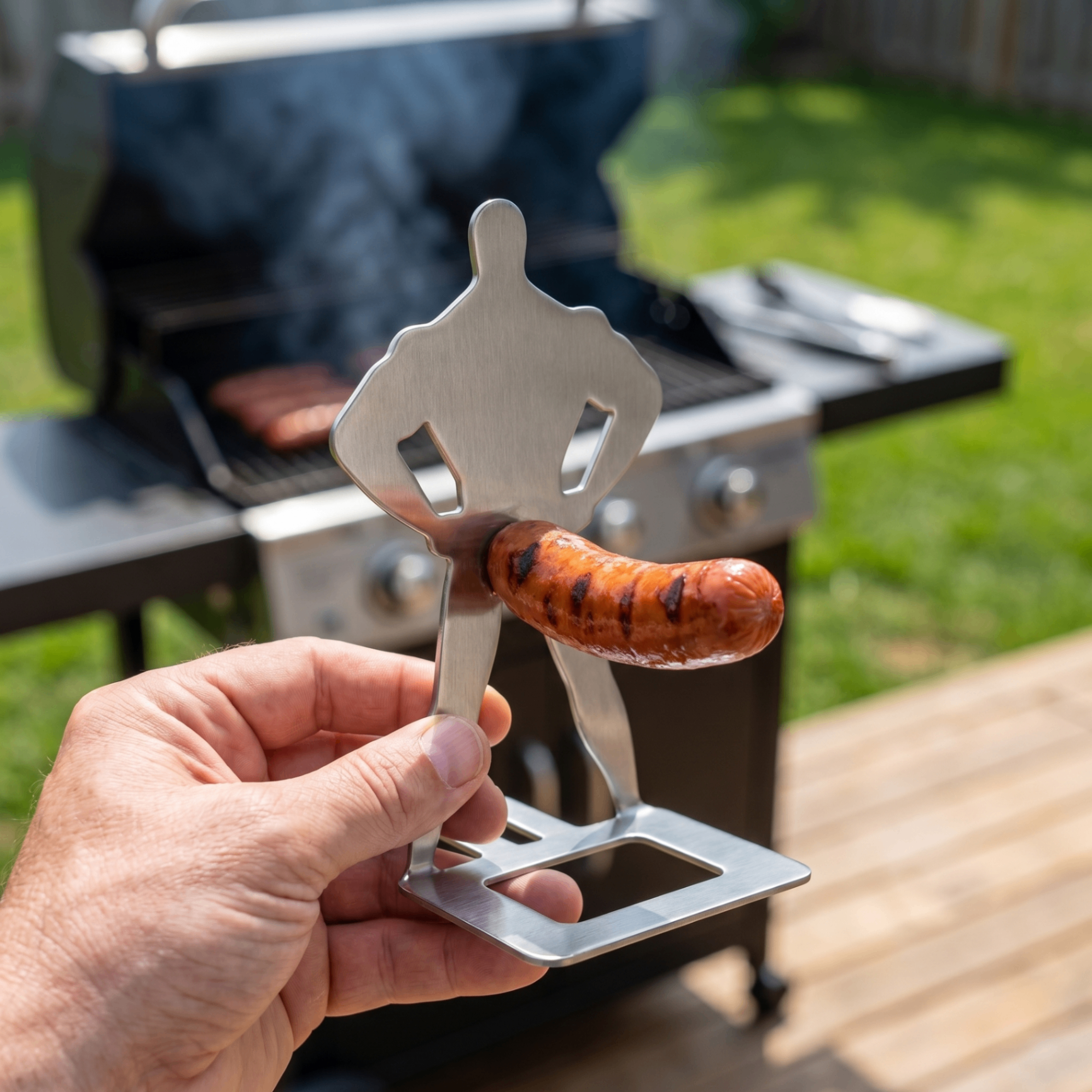Backyard Bros hot dog holder shown in hand to demonstrate scale